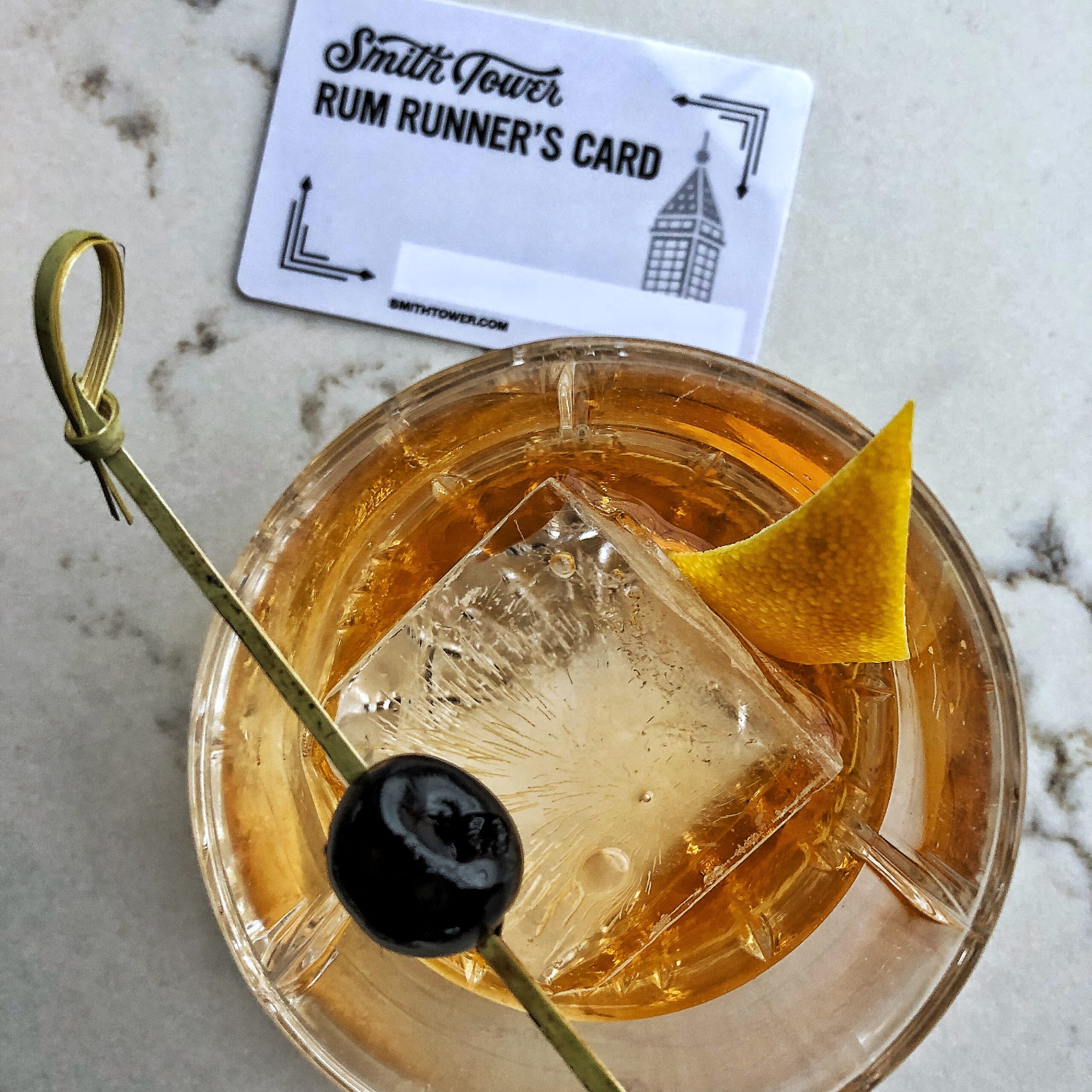 Rum Runner's Membership Card and cocktail